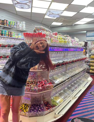 Becca in a sweet shop