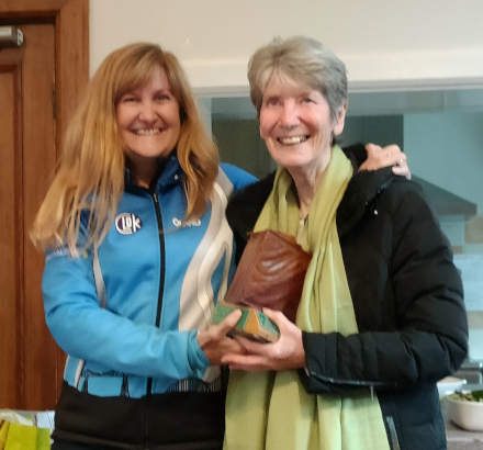 Photo of Joan Selby receiving 
the Joe Wright Trophy from Caroline Mackenzie